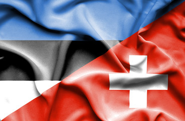 Naklejka premium Waving flag of Switzerland and Estonia