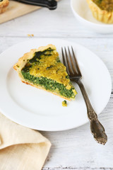 Piece of pie with spinach