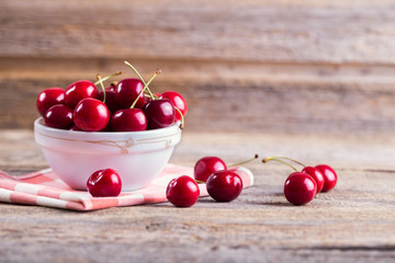 Cherries in a bowl on the table