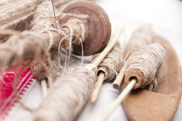 Wooden spindles with hemp threads
