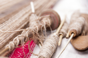 Wooden spindles with hemp threads