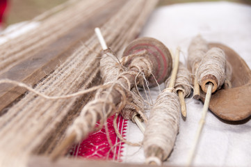 Wooden spindles with hemp threads