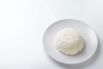 Fototapeta na wymiar Rice on white plate isolated on white background
