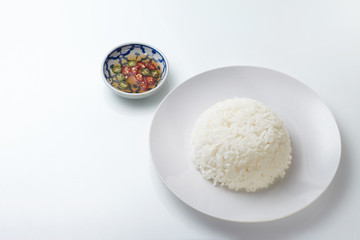 Rice on white plate isolated on white background