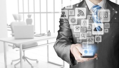 Business man using smart phone with social media icon set