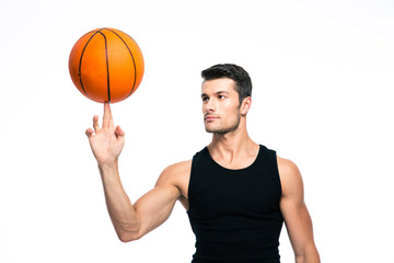 Obraz premium Basketball player spinning ball on his finger