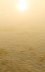 Sunshine reflecting on the surface of sea water