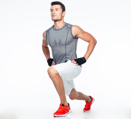 Full length portrait of a fitness man stretching