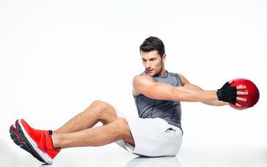 Sports man working out with fitness ball