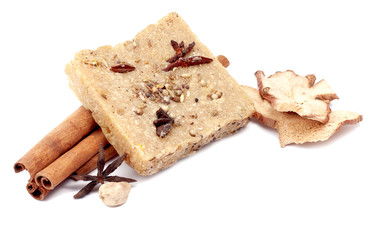handmade soap with cinnamon and anise star on white background