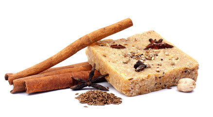 handmade soap with cinnamon and anise star on white background