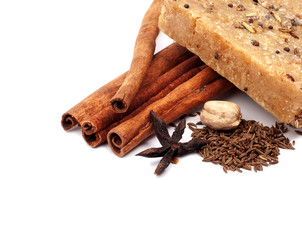handmade soap with cinnamon and anise star on white background