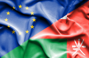 Waving flag of Oman and EU