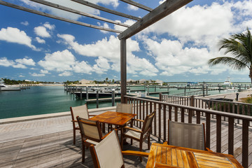 Image of a wooden dock near a marina.