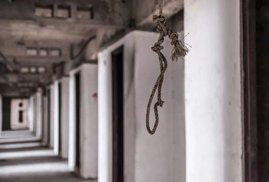 Rope for commit suicide Inside of old abandoned building