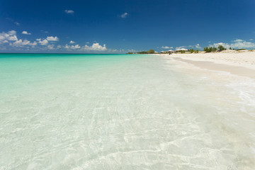 Photo of white sand beach.