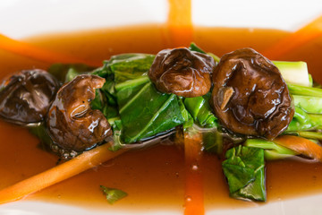 stir fried kale with oyster sauce with mushrooms