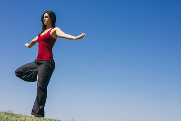 Woman doing yoga outdoors