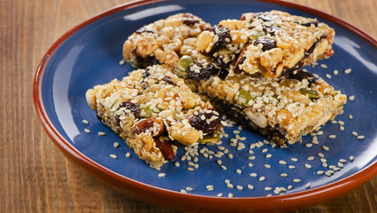 Healthy  granola bars on a blue  plate