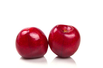Fototapeta na wymiar two bright red cherries