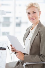 Smiling businesswoman looking at camera