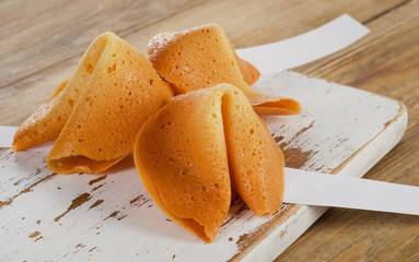 Fortune cookies  on  a wooden board.