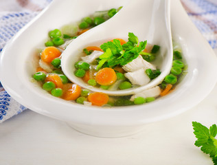 Chicken soup with vegetables in  bowl.