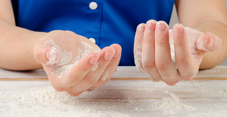 Woman hand with a  flour .
