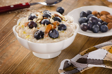 Oatmeal with blueberries and nuts  for  a Breakfast.