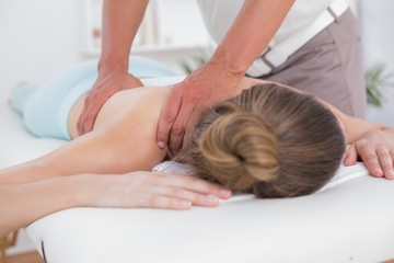Obraz na płótnie Canvas Physiotherapist doing back massage