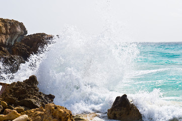 Wave crashing against the rocks