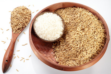 Paddy on Tray & Wood Spoon and rice on coconut isolated on white background
