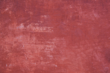 pattern on part of wall with red plaster