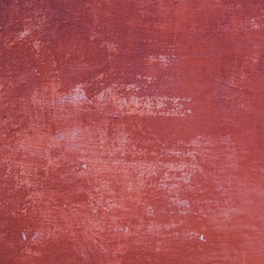 pattern on part of wall with red plaster