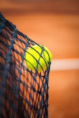 Tennis ball in net