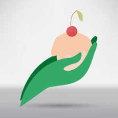 hand holding a cupcake