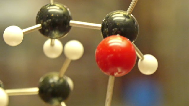 A DNA molecular structure for a microbiology study. The molecules are represented by the black white and red small balls