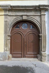 Fototapeta na wymiar Traditional wooden door in the town, Slovakia