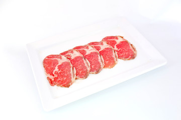 High grade sliced Hida wagyu beef isolated on white background