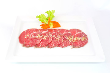 High grade sliced Hida wagyu beef isolated on white background