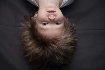 Portrait of a boy upside down