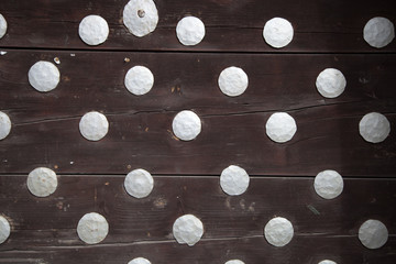 Wooden boards with  rivets