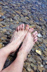tired feet on the shore of the Lake