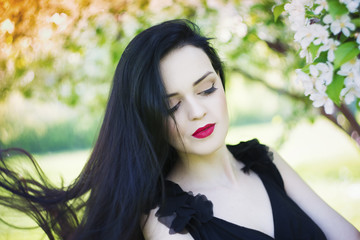 Fototapeta premium Beautiful young woman with flowers