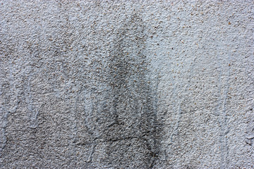 Textured walls with dirt.