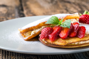 filled with homemade pancakes with strawberries