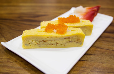 japanese egg sushi on white plate