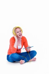 Pretty blonde listening music with her tablet computer