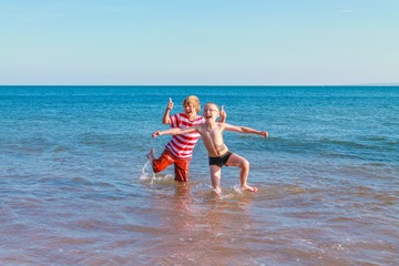 Two boys posing in the sea