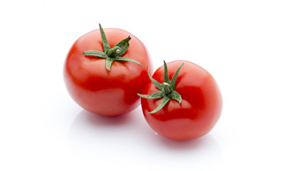 Tomato on the white isolatd background.